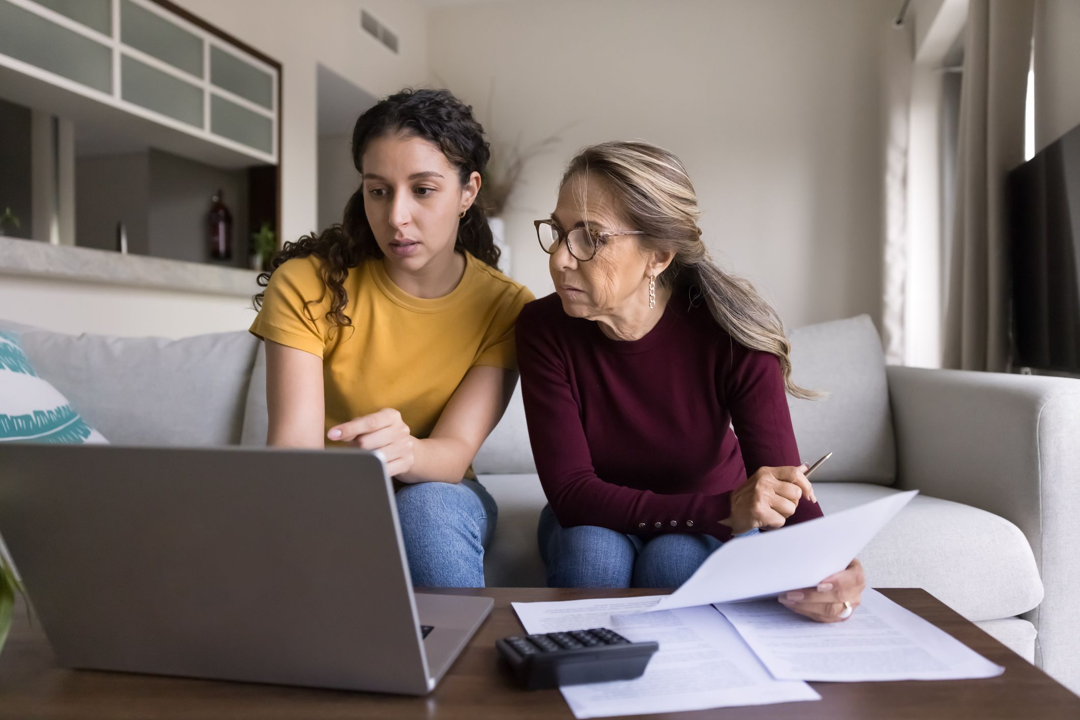 mom and daughter looking at college finances